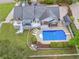 Aerial view showcasing a private backyard with a swimming pool and large deck at 8117 Spivey Rd, Jonesboro, GA 30236