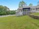 Spacious backyard with well-maintained lawn and white picket fence at 8117 Spivey Rd, Jonesboro, GA 30236