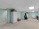 Spacious finished basement area with room for storage, and neutral carpeting at 8117 Spivey Rd, Jonesboro, GA 30236