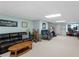 Finished basement featuring a cozy living area with a plush sofa and carpeting at 8117 Spivey Rd, Jonesboro, GA 30236