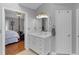 Bathroom features a vanity, ample storage, and view into the main bedroom at 8117 Spivey Rd, Jonesboro, GA 30236