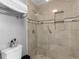 Tiled walk-in shower with built in niche and decorative accents at 8117 Spivey Rd, Jonesboro, GA 30236