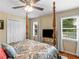 Bedroom features hardwood floors, four poster bed, and neutral decor at 8117 Spivey Rd, Jonesboro, GA 30236