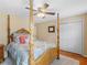 Beautiful bedroom featuring a four-post bed, ceiling fan, and closet at 8117 Spivey Rd, Jonesboro, GA 30236