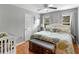 Comfortable bedroom with queen size bed, hardwood floors, and light walls at 8117 Spivey Rd, Jonesboro, GA 30236