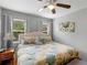 Relaxing bedroom with hardwood floors, light walls, and natural light at 8117 Spivey Rd, Jonesboro, GA 30236