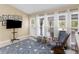 Bonus room features multiple windows and an exterior door leading to the back yard at 8117 Spivey Rd, Jonesboro, GA 30236