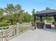 Spacious outdoor deck featuring a gazebo and seating area overlooking the manicured lawn at 8117 Spivey Rd, Jonesboro, GA 30236