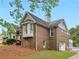 Charming brick home with bay window and manicured lawn at 8117 Spivey Rd, Jonesboro, GA 30236