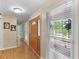 Bright foyer with hardwood floors, a wooden door, and a view to the outside at 8117 Spivey Rd, Jonesboro, GA 30236