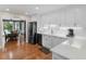 Stylish kitchen with sleek white cabinets, stainless appliances, and hardwood floors at 8117 Spivey Rd, Jonesboro, GA 30236