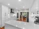 Modern kitchen featuring white cabinets, stainless steel appliances, and an open concept design at 8117 Spivey Rd, Jonesboro, GA 30236