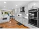 Bright and spacious kitchen with stainless appliances and an adjacent breakfast nook area at 8117 Spivey Rd, Jonesboro, GA 30236