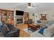 Cozy living room with a brick fireplace, built-in shelves, and comfortable seating arrangement at 8117 Spivey Rd, Jonesboro, GA 30236