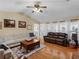 Spacious living room showcasing hardwood floors, ample seating, and natural light at 8117 Spivey Rd, Jonesboro, GA 30236