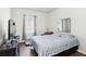 Bedroom with ample sunlight from the window, light-colored walls, and minimal furniture at 109 Logan Pass Dr, Loganville, GA 30052