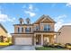 Beautiful brick and siding two-story home with a two-car garage and well-manicured lawn at 109 Logan Pass Dr, Loganville, GA 30052