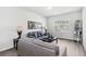 Living area features neutral color palette, stylish decor, and hardwood flooring for a serene atmosphere at 109 Logan Pass Dr, Loganville, GA 30052