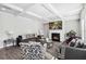 Spacious living room boasts trey ceilings, a cozy fireplace, and stylish decor for comfortable living at 109 Logan Pass Dr, Loganville, GA 30052
