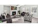 Bright living room with tray ceilings, a fireplace, and neutral decor, ideal for relaxation at 109 Logan Pass Dr, Loganville, GA 30052