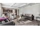 Open-concept living area with modern furnishings, tray ceilings, and seamless flow to other spaces at 109 Logan Pass Dr, Loganville, GA 30052