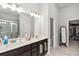 Modern main bathroom with double sink vanity and walk-in shower at 109 Logan Pass Dr, Loganville, GA 30052