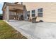 Concrete patio featuring outdoor seating and a view of the backyard and adjacent properties at 109 Logan Pass Dr, Loganville, GA 30052