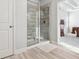 Elegant glass enclosed shower and tile flooring in the main bathroom at 109 Logan Pass Dr, Loganville, GA 30052