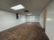 Finished basement with neutral walls, carpet, and a window at 1301 Winesap Se Ct, Conyers, GA 30013