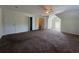 Spacious bedroom with carpet, doors, a window, and neutral walls at 1301 Winesap Se Ct, Conyers, GA 30013