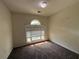 Cozy bedroom with neutral walls, carpet, and natural light from a window at 1301 Winesap Se Ct, Conyers, GA 30013