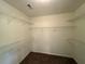 Walk-in closet with wire shelving for optimal storage and organization at 1301 Winesap Se Ct, Conyers, GA 30013
