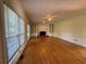 Large living room with hardwood floors, a fireplace and bright windows at 1301 Winesap Se Ct, Conyers, GA 30013