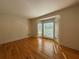 Bright room with a bay window, offering ample natural light and shiny hardwood floors at 1301 Winesap Se Ct, Conyers, GA 30013