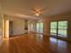 Spacious living room with hardwood floors, a ceiling fan, and abundant natural light at 1301 Winesap Se Ct, Conyers, GA 30013