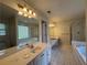 Bathroom with a tub, a separate shower and double sinks at 1301 Winesap Se Ct, Conyers, GA 30013
