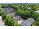 Stunning aerial view of townhomes surrounded by lush green trees in a neighborhood near the city at 1605 Pavillion Ridge Se Dr, Smyrna, GA 30080