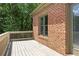 Picture of wooden deck, brick siding and green foliage at 1605 Pavillion Ridge Se Dr, Smyrna, GA 30080