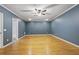 Spacious finished basement with wood floors, ceiling fan and adjacent bathroom at 1605 Pavillion Ridge Se Dr, Smyrna, GA 30080