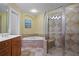 The primary bath features a double vanity, walk-in shower and separate jacuzzi tub at 1605 Pavillion Ridge Se Dr, Smyrna, GA 30080