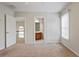Bright bedroom with neutral carpet, a ceiling fan and views to the upstairs hallway and bathroom at 1605 Pavillion Ridge Se Dr, Smyrna, GA 30080