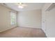 This bedroom has light neutral walls and tan carpet at 1605 Pavillion Ridge Se Dr, Smyrna, GA 30080