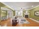 Bright and airy living room with hardwood floors, fireplace, and large windows with natural light at 1605 Pavillion Ridge Se Dr, Smyrna, GA 30080