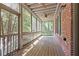 Inviting screened porch with ceiling fans and wooded views at 1605 Pavillion Ridge Se Dr, Smyrna, GA 30080