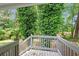 Wood deck features green views of the surrounding trees and plants at 1640 Fairburn Sw Rd, Atlanta, GA 30331