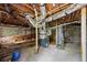 Unfinished basement with exposed ductwork and stone foundation at 1640 Fairburn Sw Rd, Atlanta, GA 30331