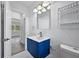 Bright bathroom with modern vanity, light fixture and mirror and tile flooring at 1640 Fairburn Sw Rd, Atlanta, GA 30331