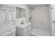 Modern bathroom featuring a white vanity, marble shower, and sleek fixtures, perfect for a luxurious experience at 1640 Fairburn Sw Rd, Atlanta, GA 30331