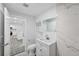 Modern bathroom with a vanity and a sleek tile design, with a laundry room view at 1640 Fairburn Sw Rd, Atlanta, GA 30331