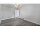 Spacious bedroom with hardwood floors, ample natural light, and a ceiling fan providing a calming space at 1640 Fairburn Sw Rd, Atlanta, GA 30331
